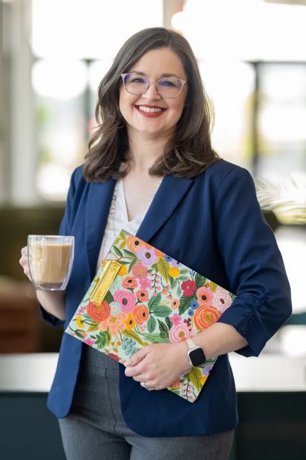 Allison Marx reviewing notes on a clipboard